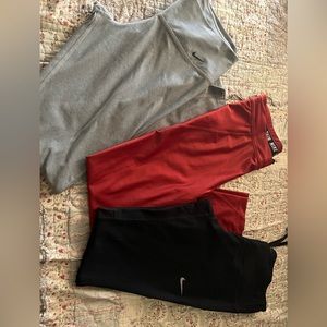 3 nike pants grey, red and black.
